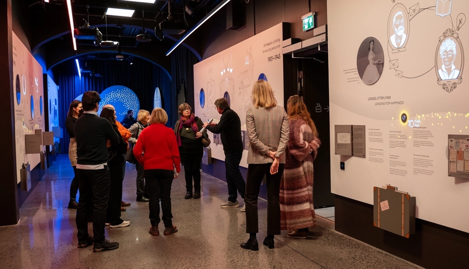 people getting a guided tour in one of the exhibitions.