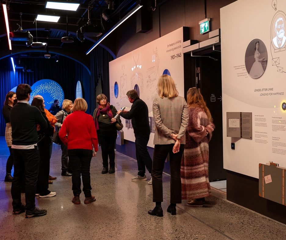 people getting a guided tour in one of the exhibitions.