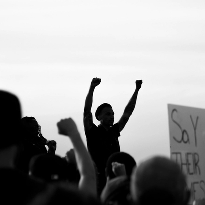 people silouettes protesting