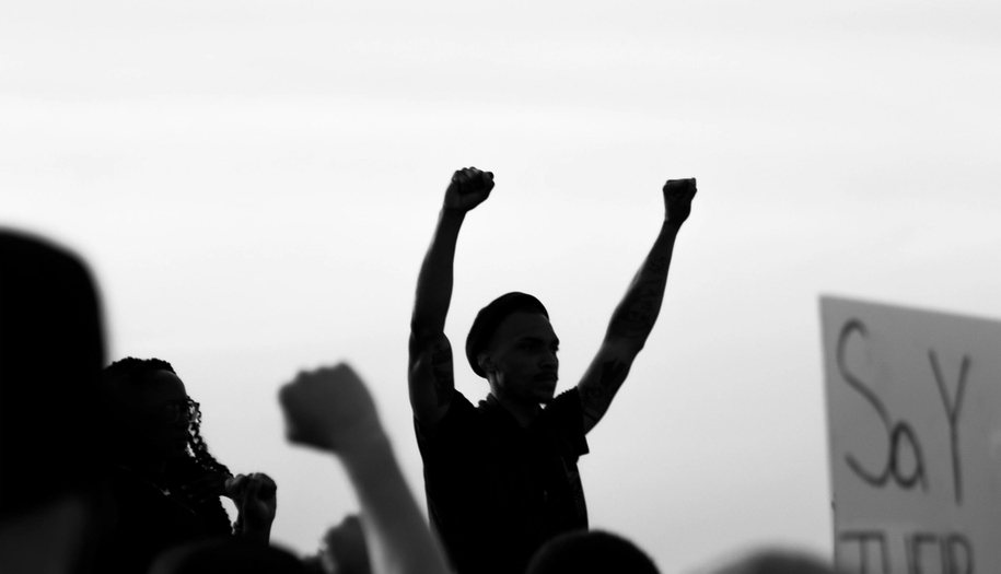 people protesting, someone standing higher up
