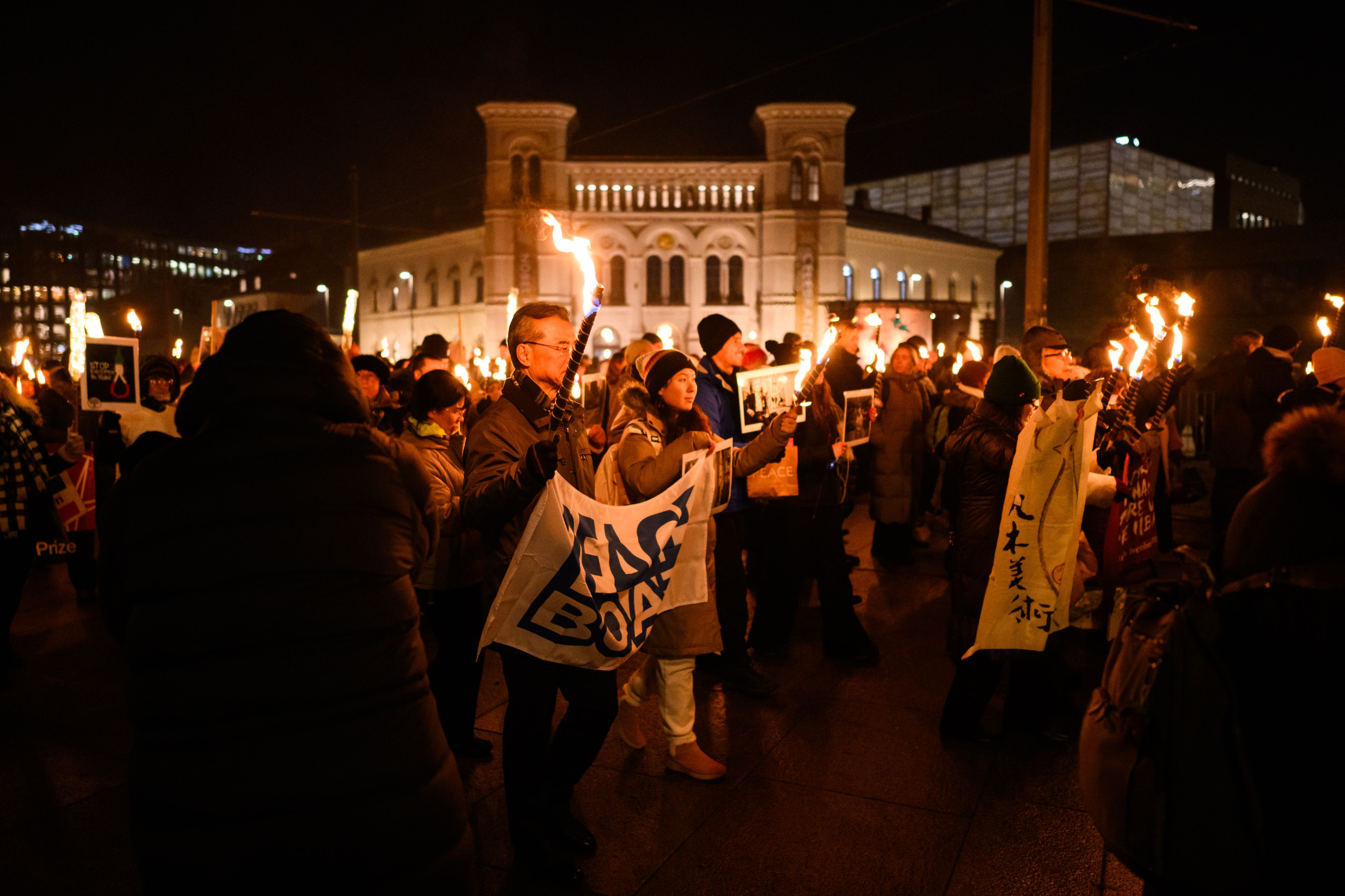 Torchlight procession in front of the nobel peace center in 2024.