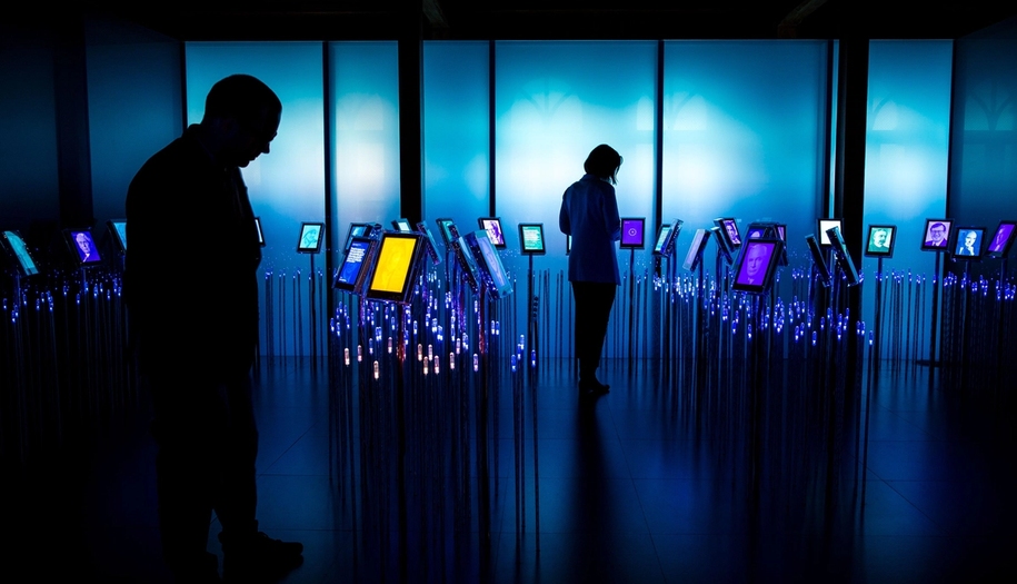 Two people standing in one of our permanent exhibitions, Nobel field.