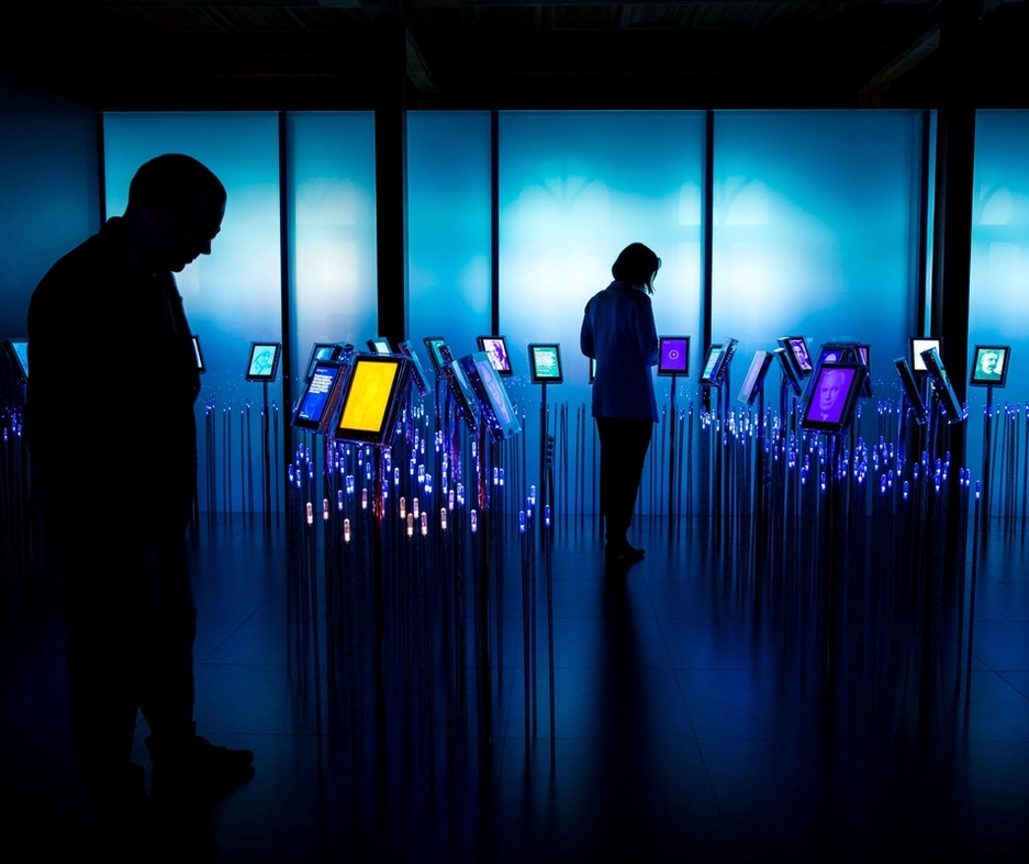 Two people standing in one of our permanent exhibitions, Nobel field.