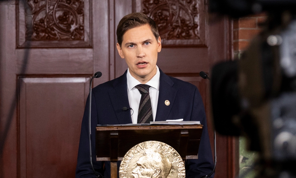 chair of nobel committe on the podium announcing the nobel peace prize laureate 2025