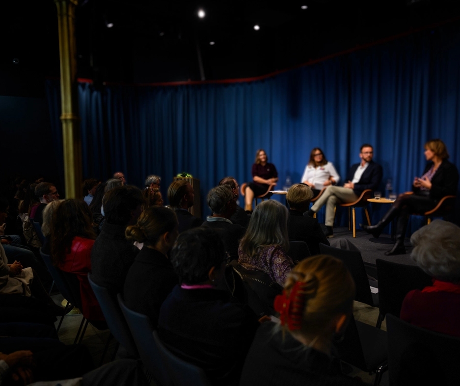A conversation in the mandela room, panel on stage and audience.