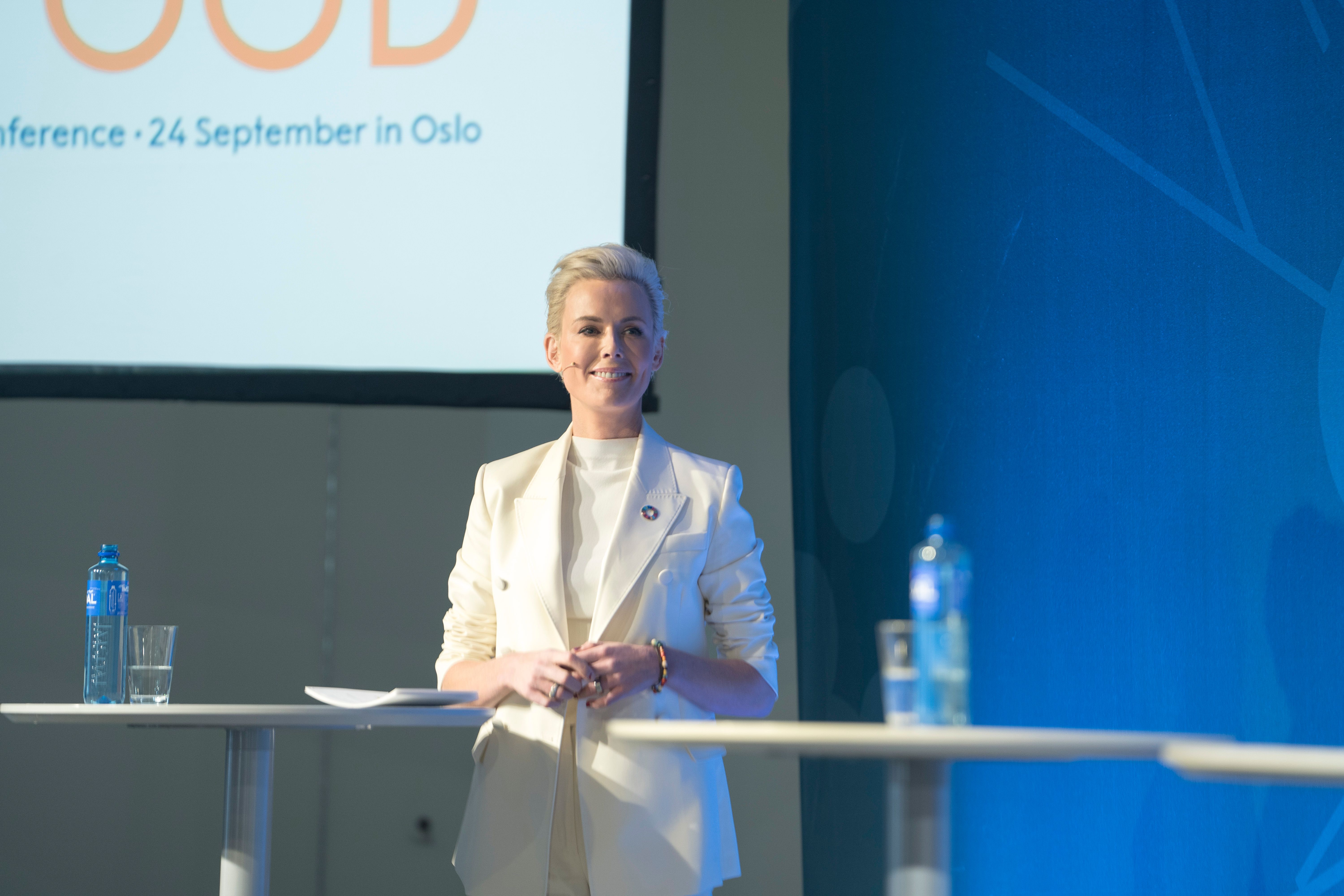 lady on stage of conference.