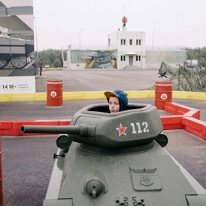 a boy in a toy tanks.