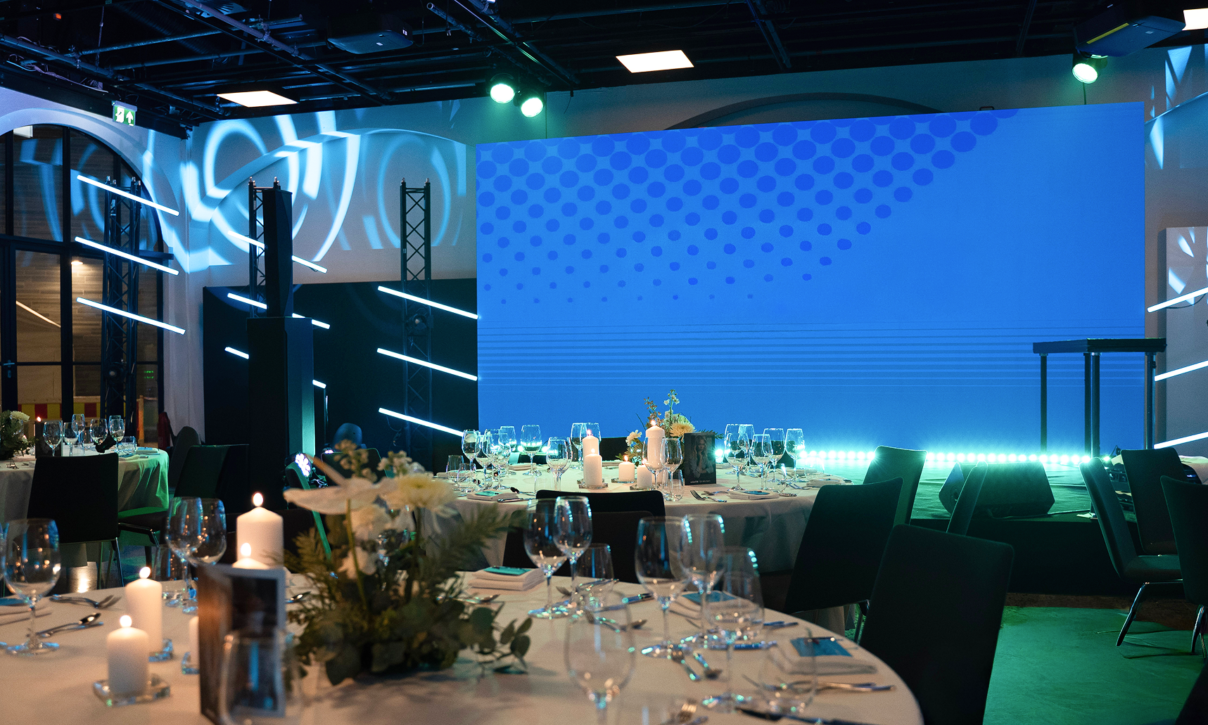 Arranged train hall with lights and table settings