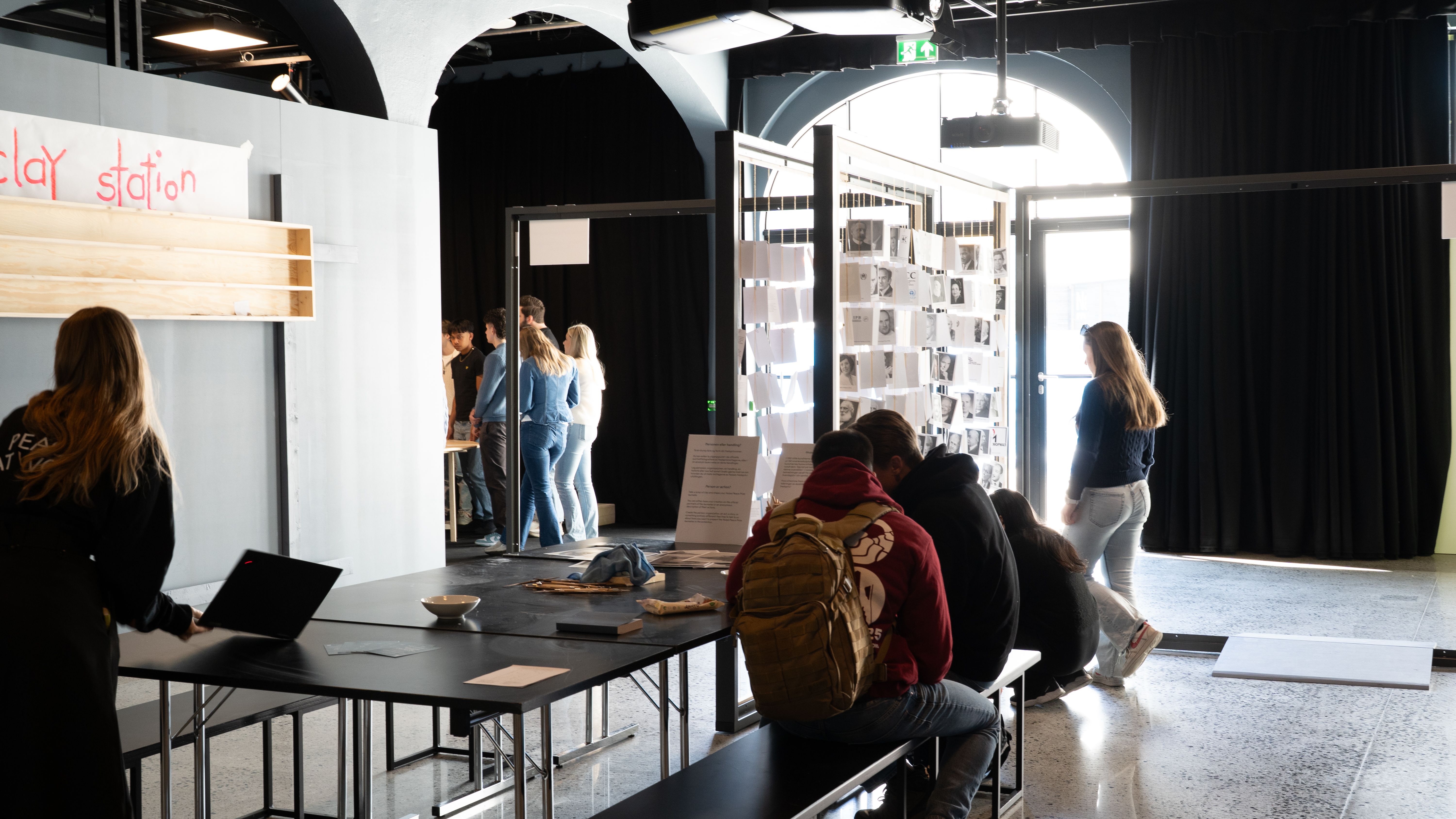 in the labratory, people around doing acitivites