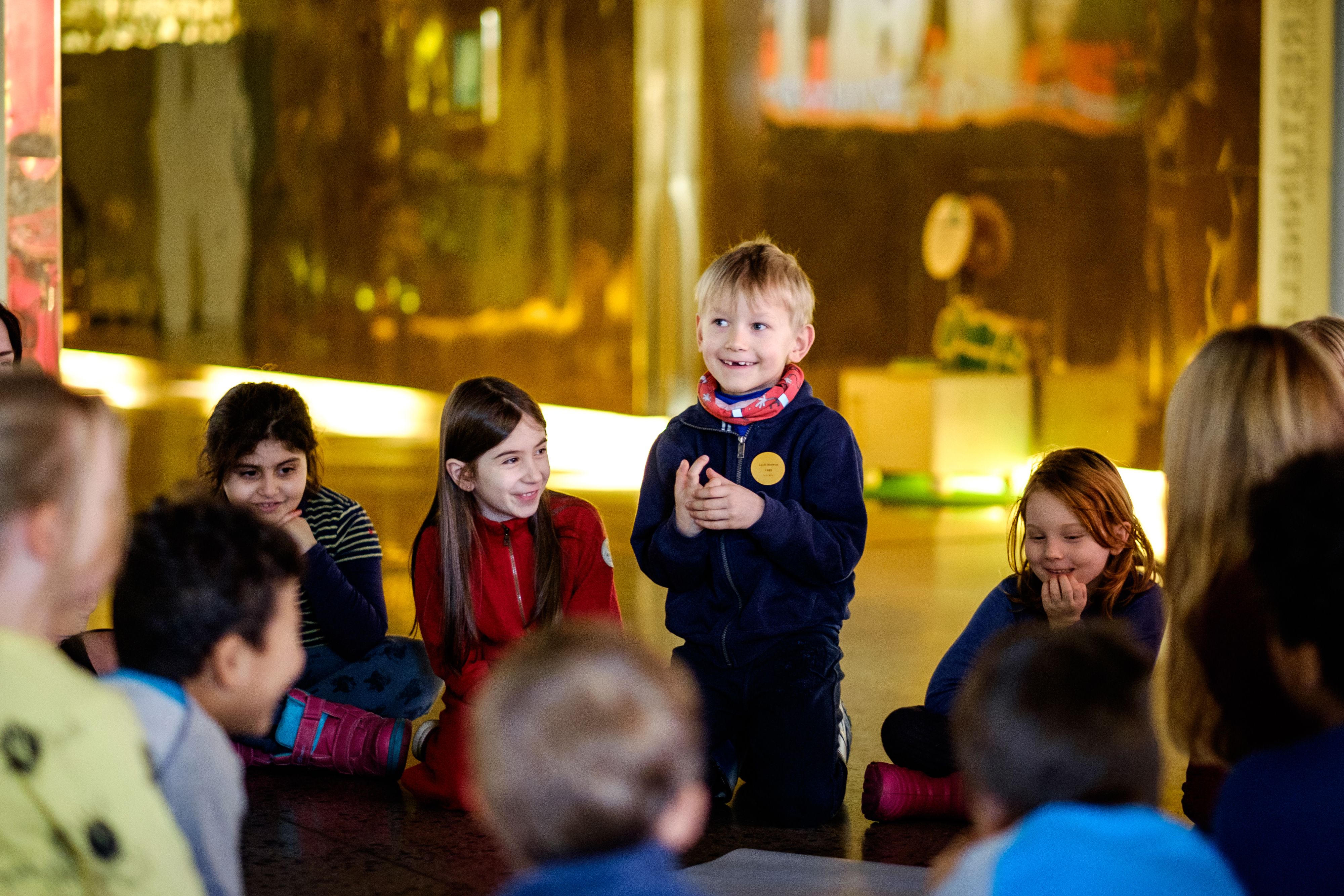 children at the nobel peace center talking together