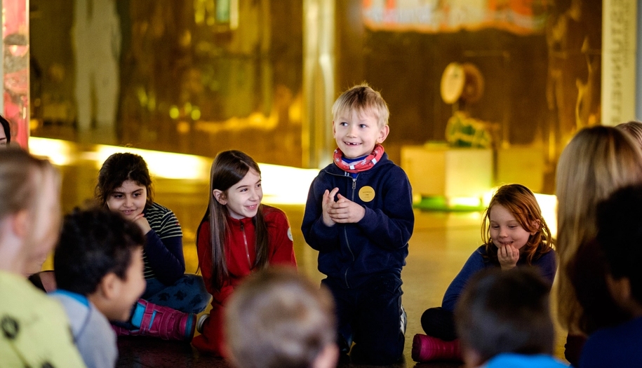 children at the nobel peace center talking together
