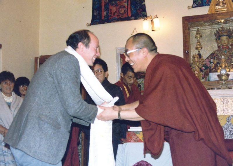 Dalai lama greeting man