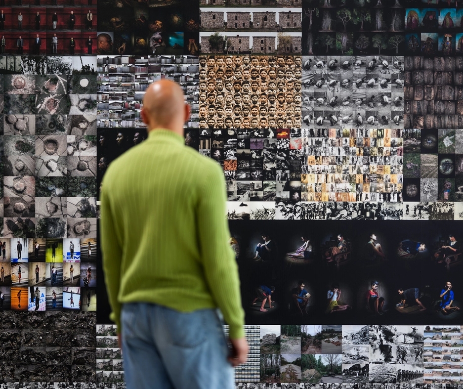 The exhibition, person standing in front of an installation