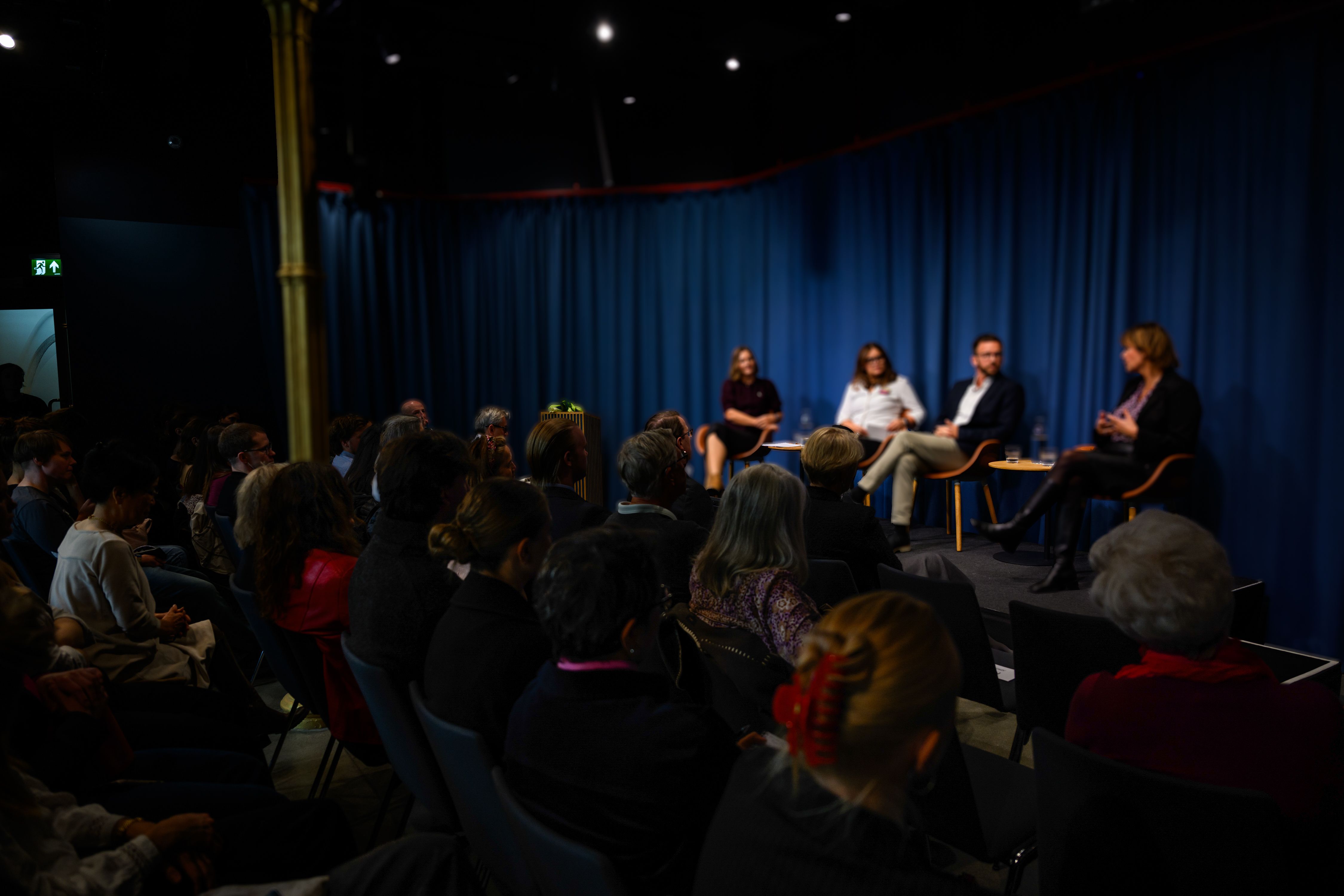 from event with panelists on stage and audience.