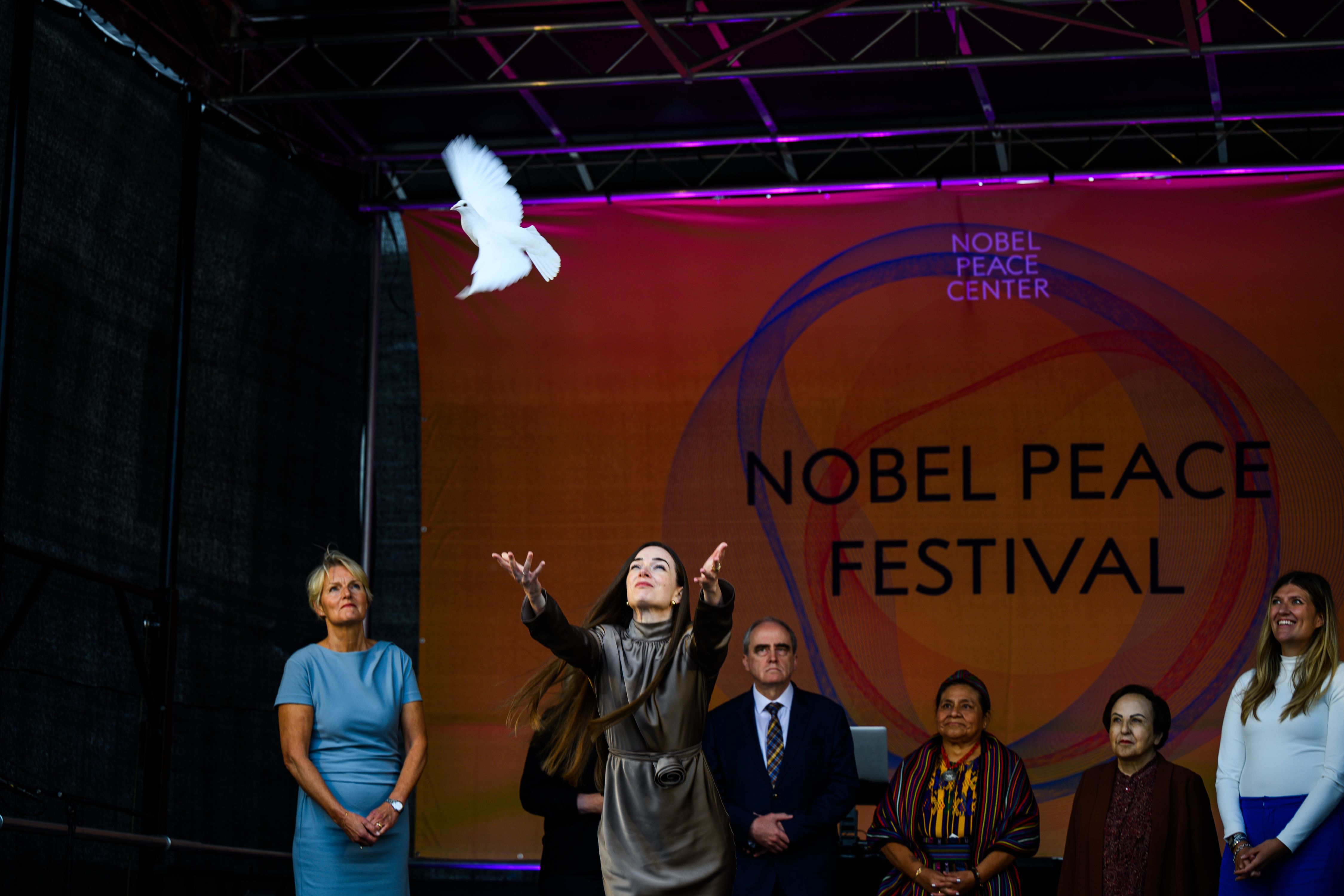 Oleksandra releases a dove during the nobel peace festival