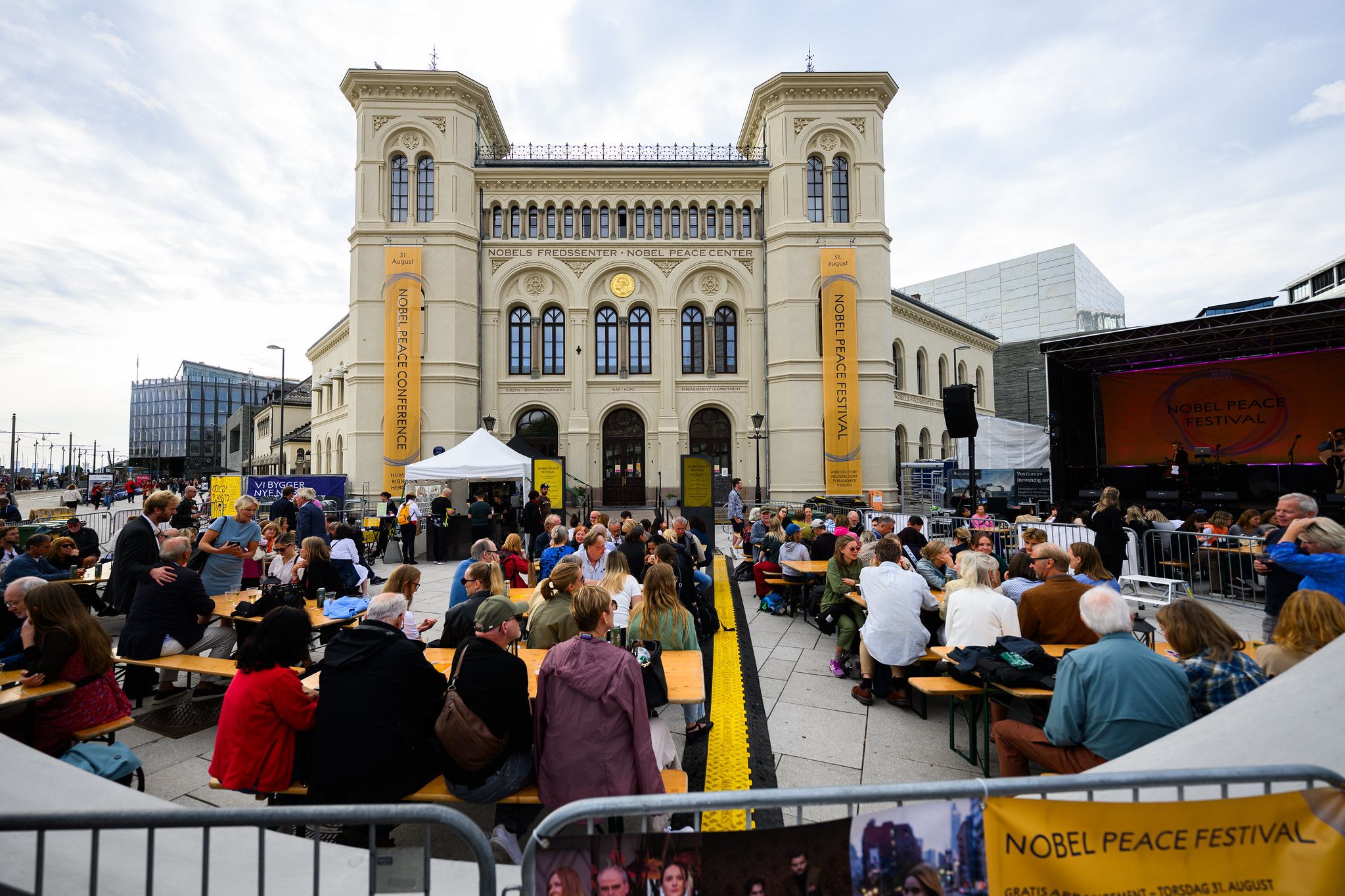 the front of the nobel peace center with plenty of people visiting.