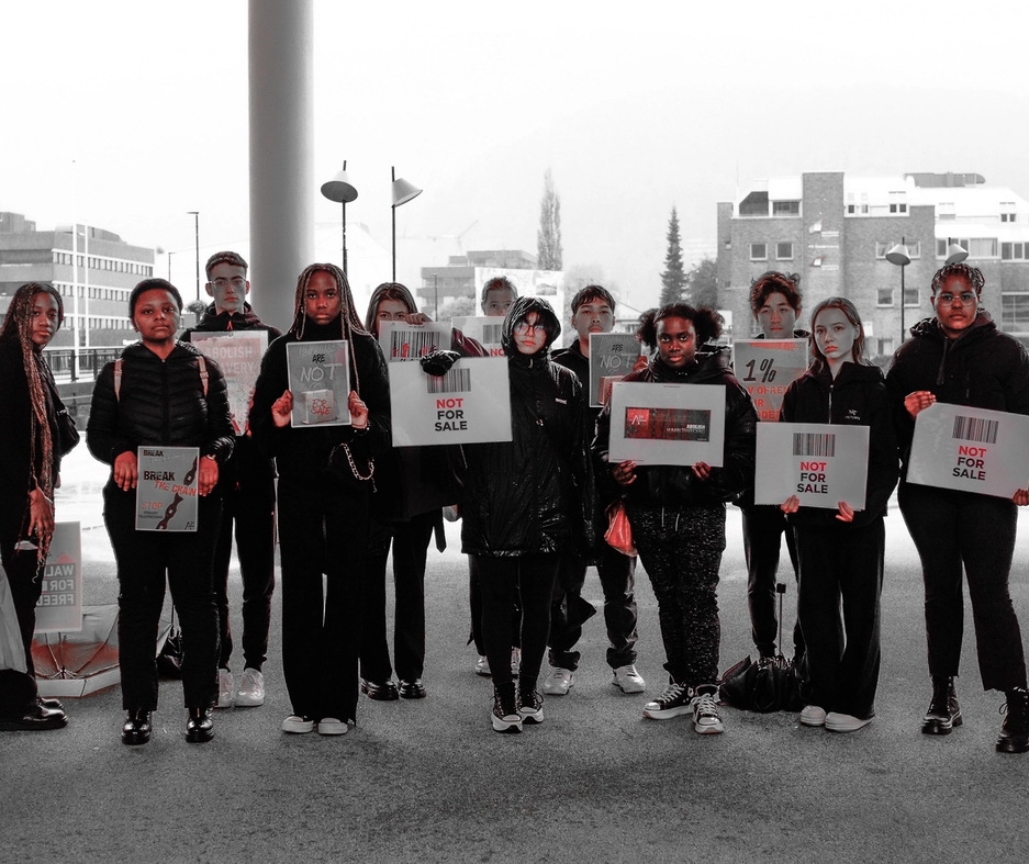 United world college group of protestors , against human slavery.