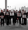 United world college group of protestors , against human slavery.