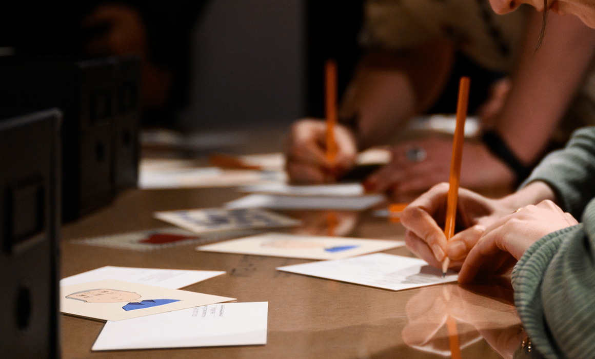 people writing postcards.