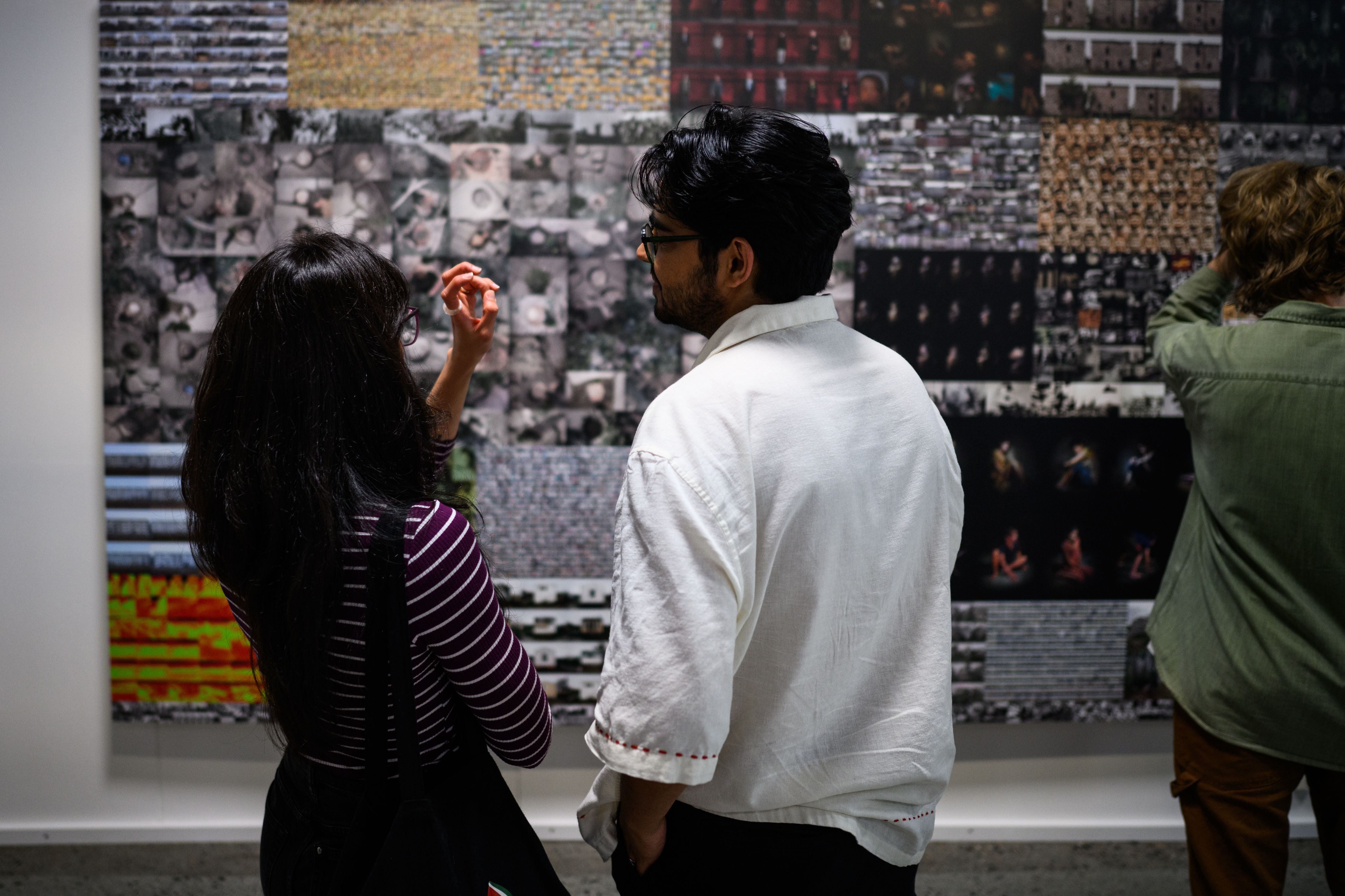 people in the exhibition war is peace.