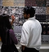 people in the exhibition war is peace.