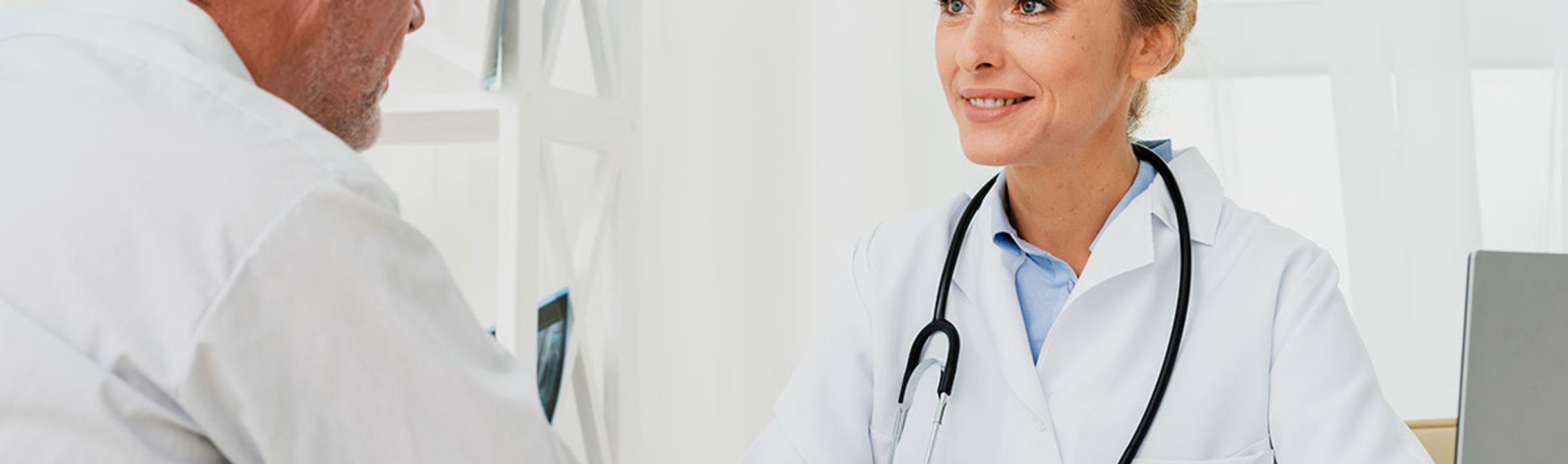 Doctor discussing personalized healthcare options with an older patient during an unhurried visit.