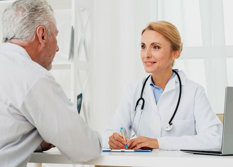 Doctor discussing personalized healthcare options with an older patient during an unhurried visit.