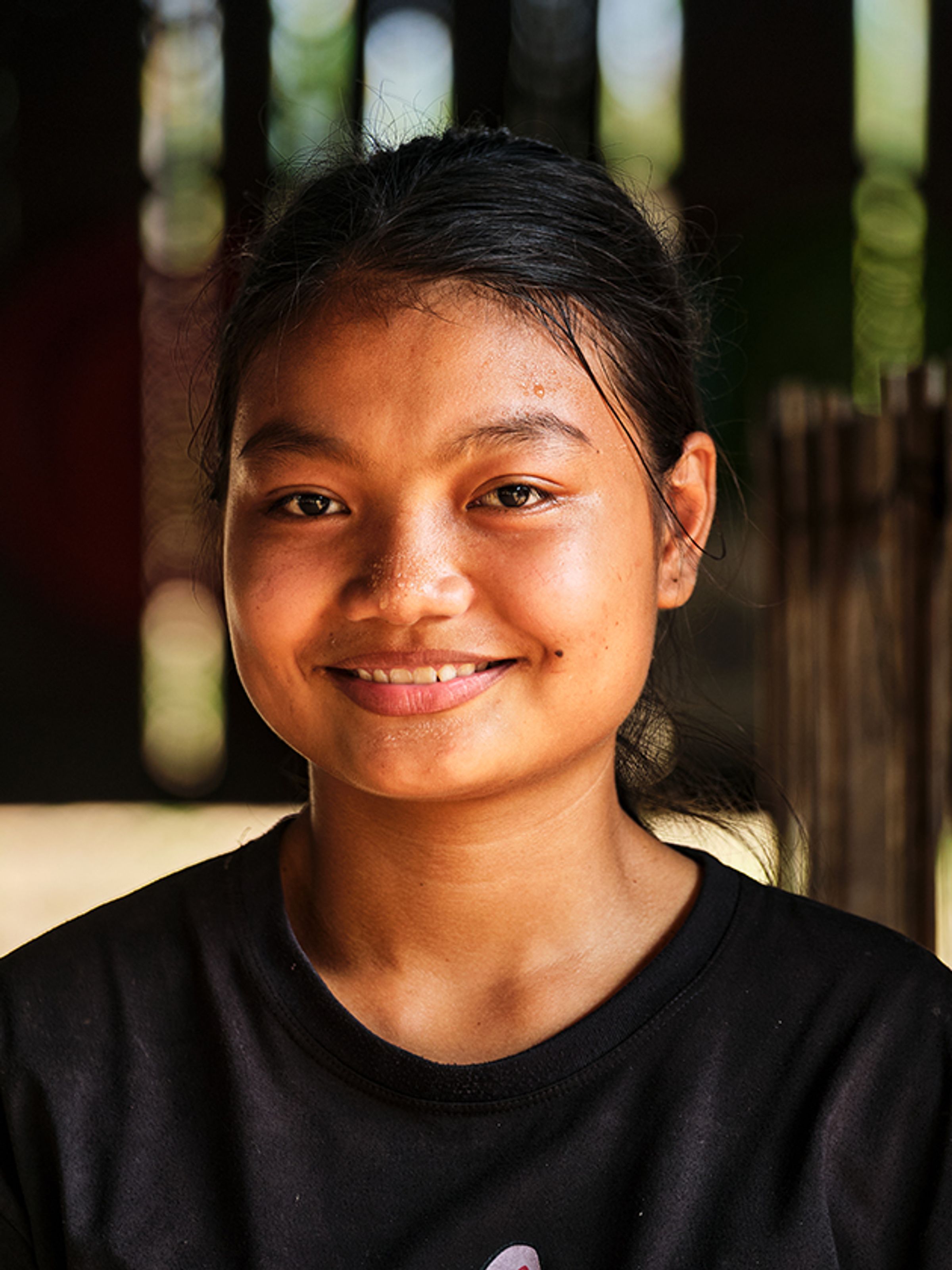 A young woman smiling