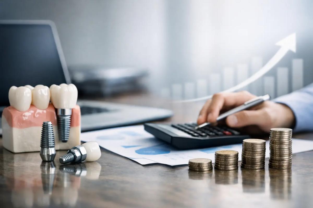 Dental implant model beside stacked coins and a hand using a calculator, with a growth chart arrow in the background.
