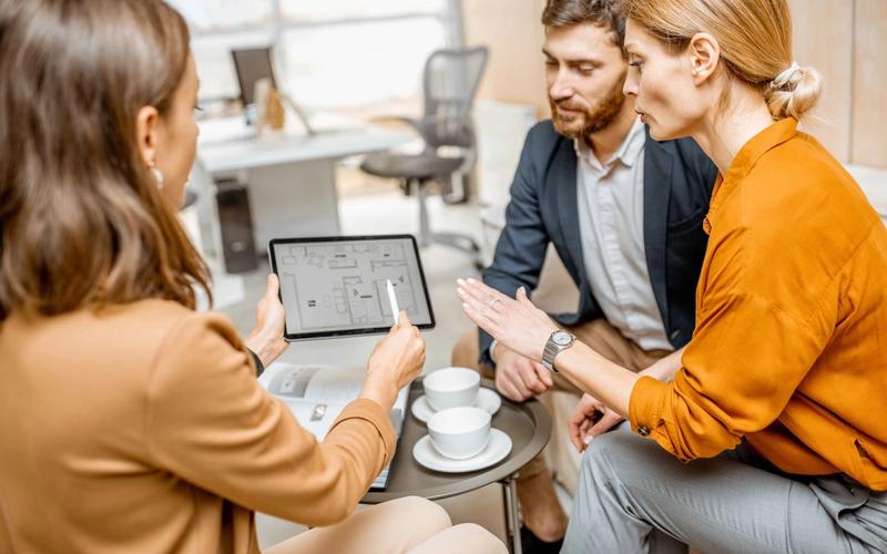 Real estate professionals discussing new NAR compensation regulations