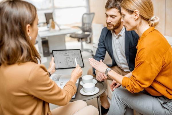 Real estate professionals discussing new NAR compensation regulations