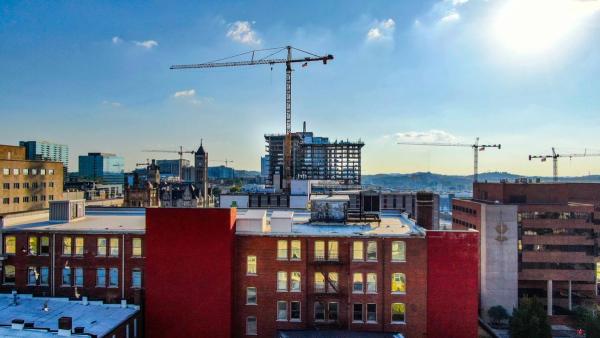 Nashville skyline with construction cranes — development boom creating rental opportunities
