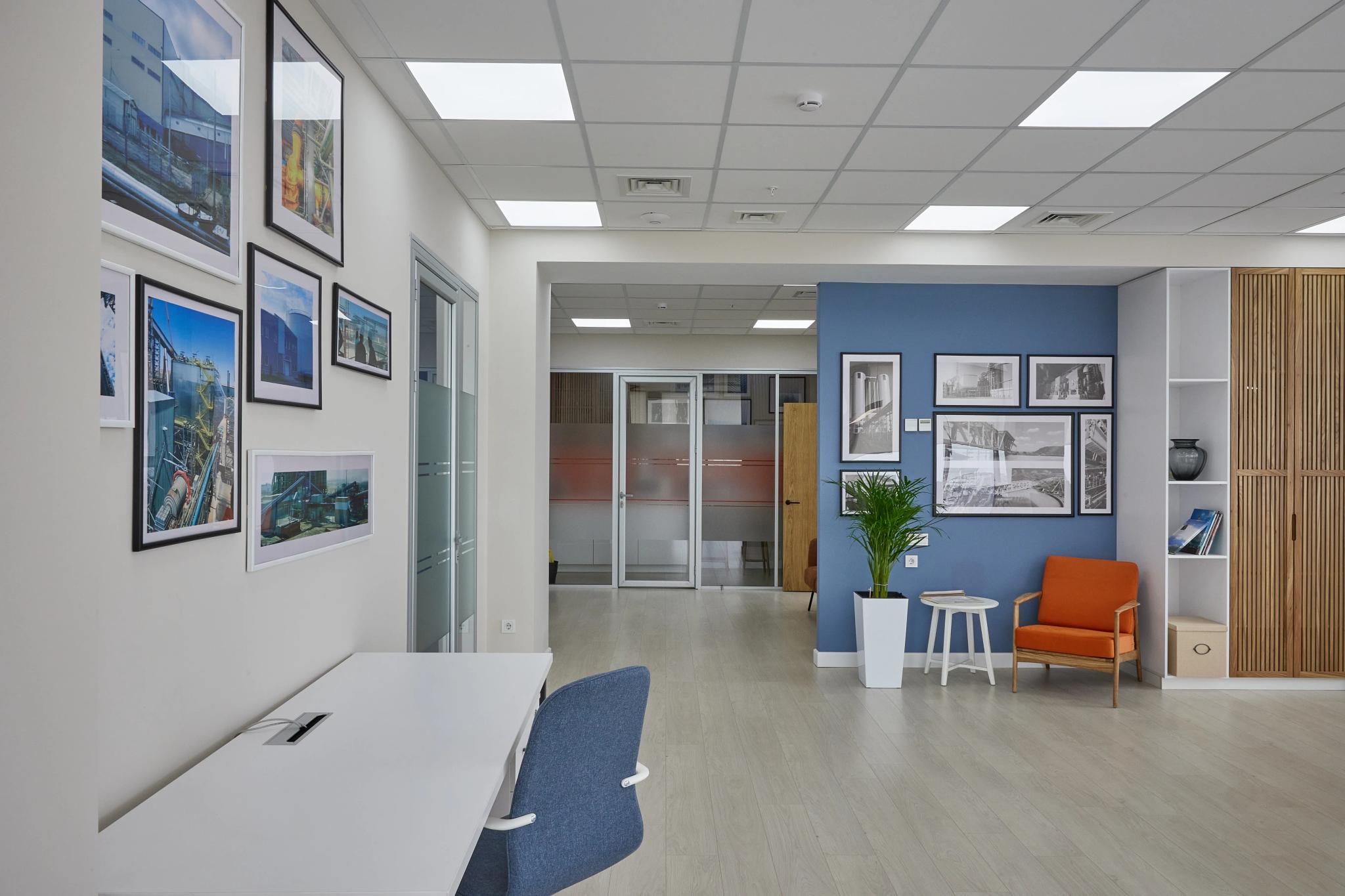 Modern Capital Tower office in Almaty featuring reception area, blue accent wall and contemporary furniture - professional interior photography Kazakhstan