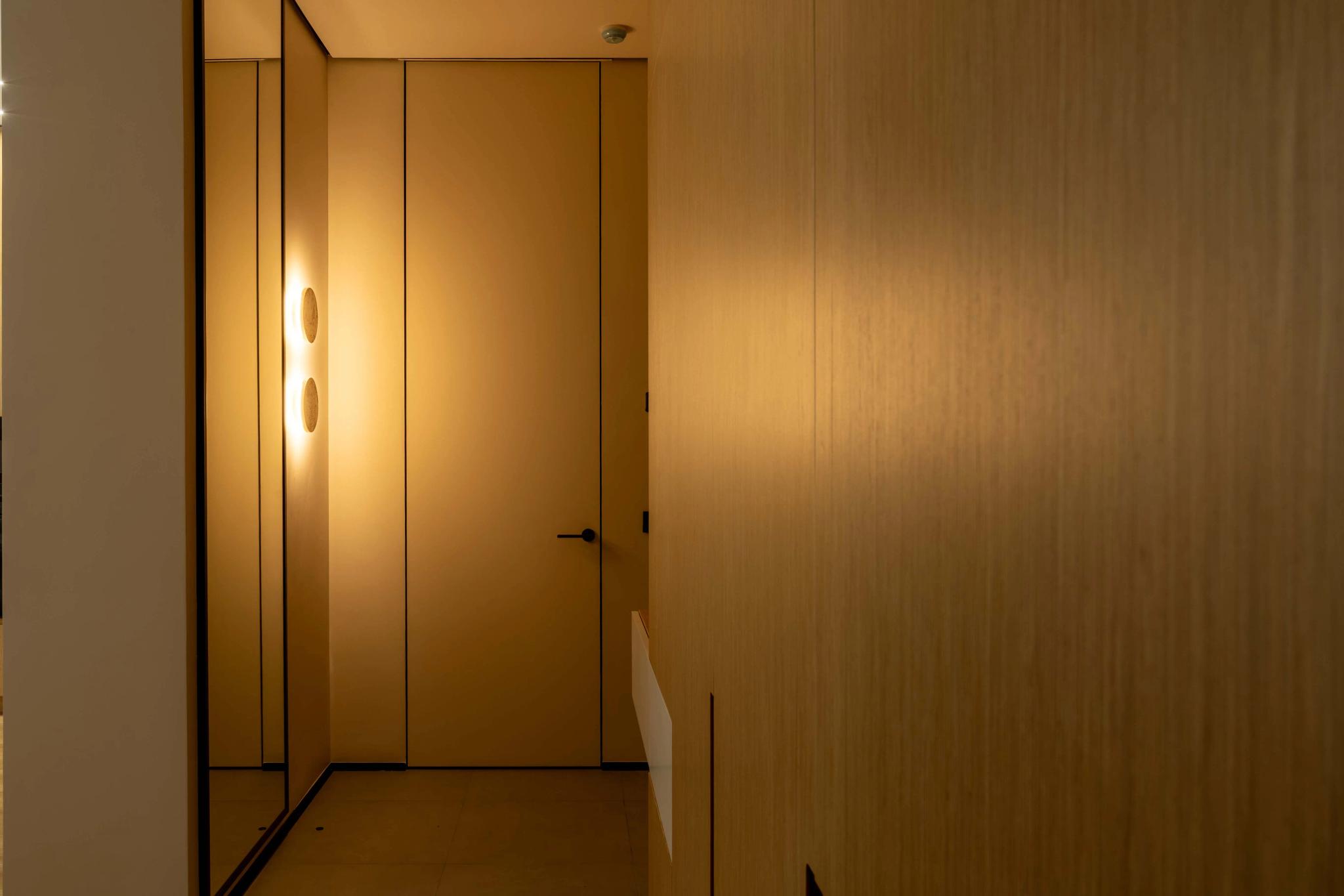 Contemporary hallway with wooden wall panels and integrated lighting, interior photography Kazakhstan