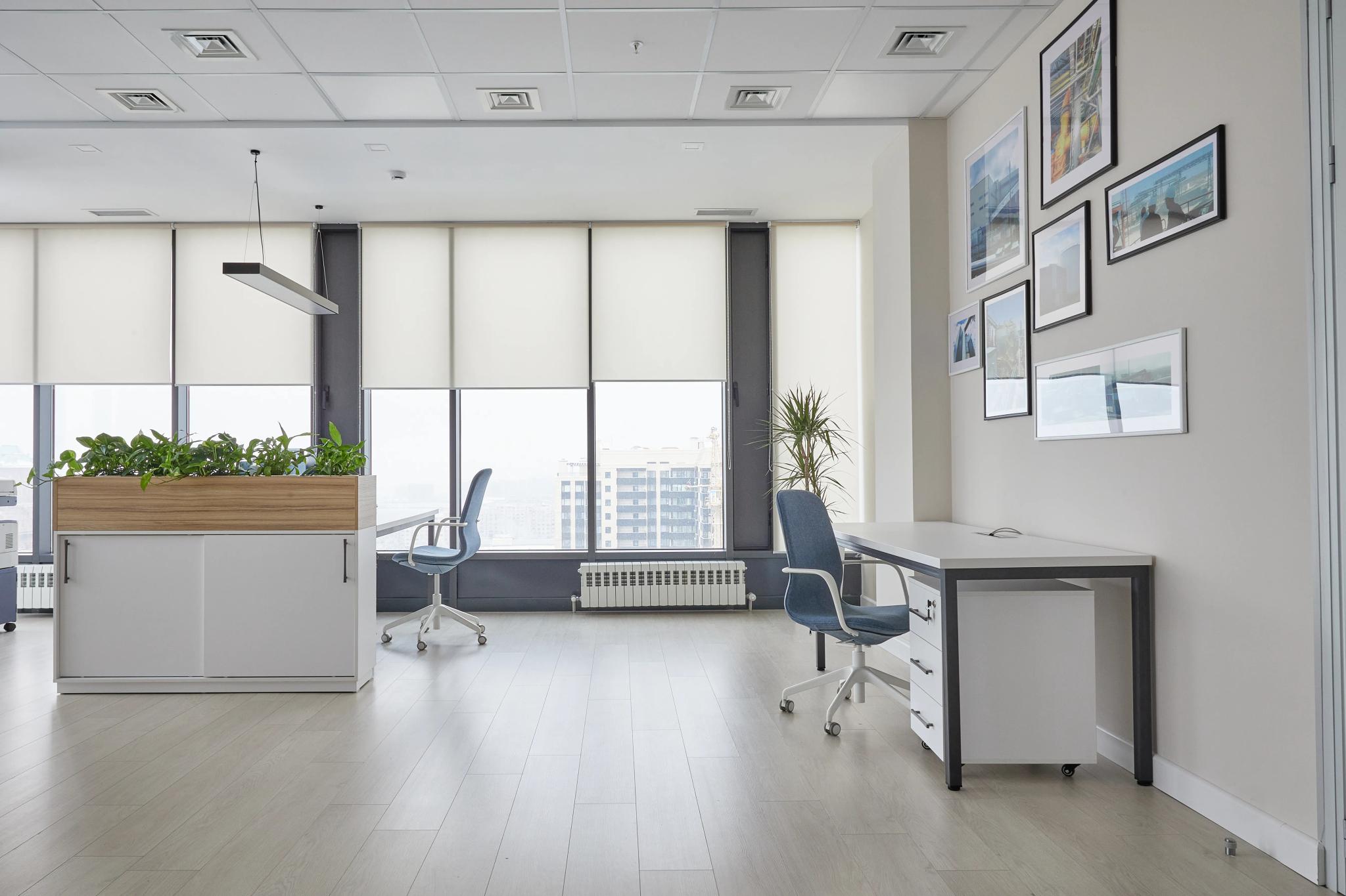 Modern Capital Tower office in Almaty featuring panoramic windows, workspaces and greenery - professional commercial interior photography Kazakhstan