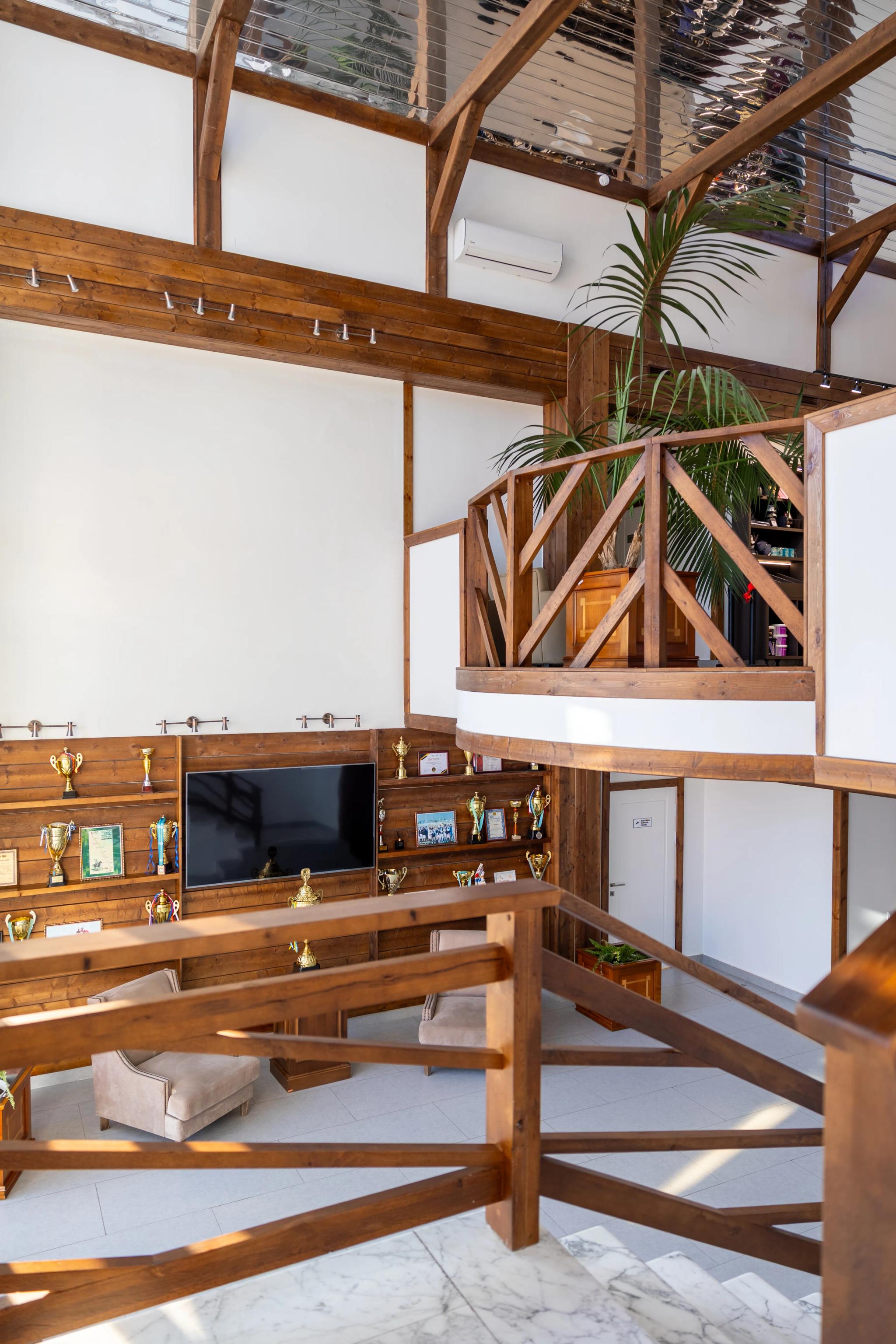 Contemporary equestrian club interior with wooden beams and TV lounge, architectural photography Astana