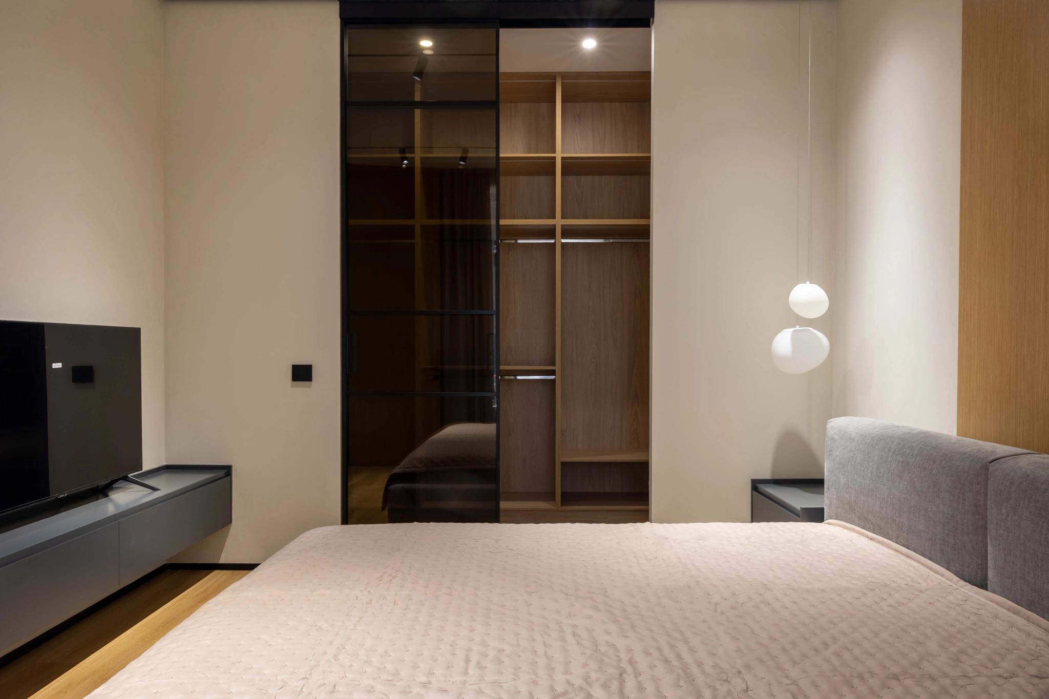 Modern bedroom with built-in wardrobe, professional interior photography Kazakhstan