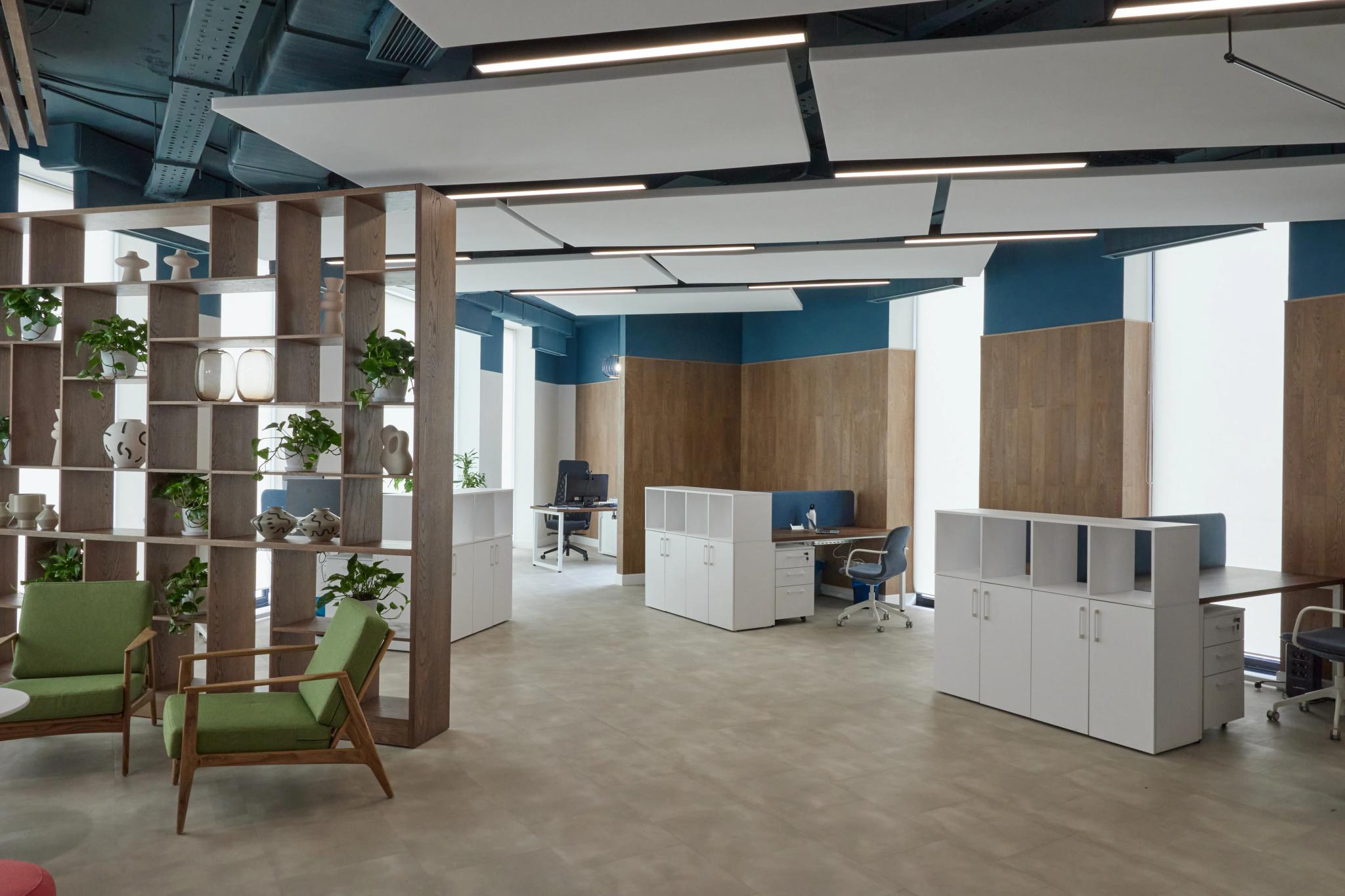 Modern open-space office at Esentai City featuring wooden partitions and blue accents - professional commercial interior shoot in Almaty, Kazakhstan