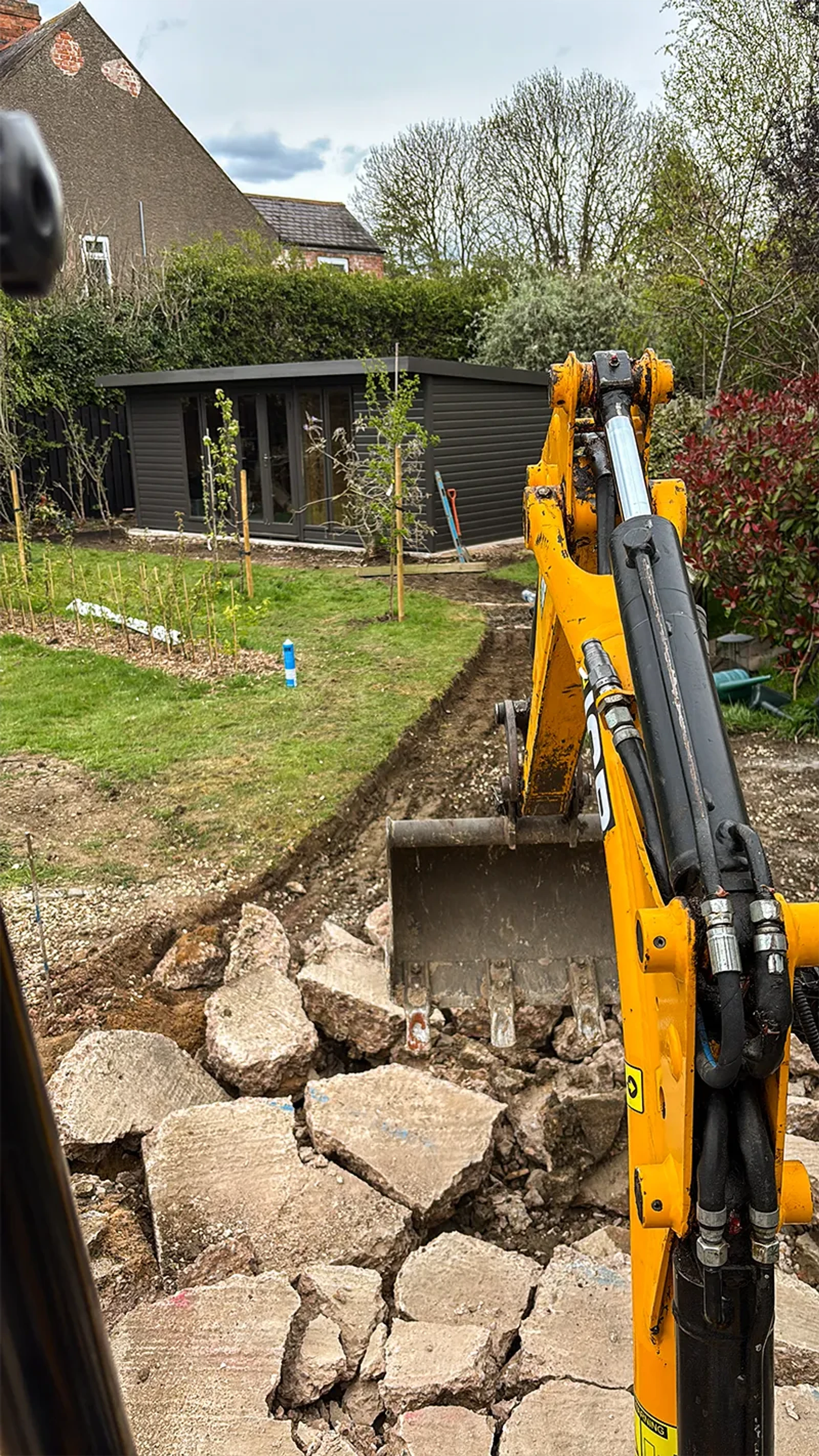 Digger digging up path