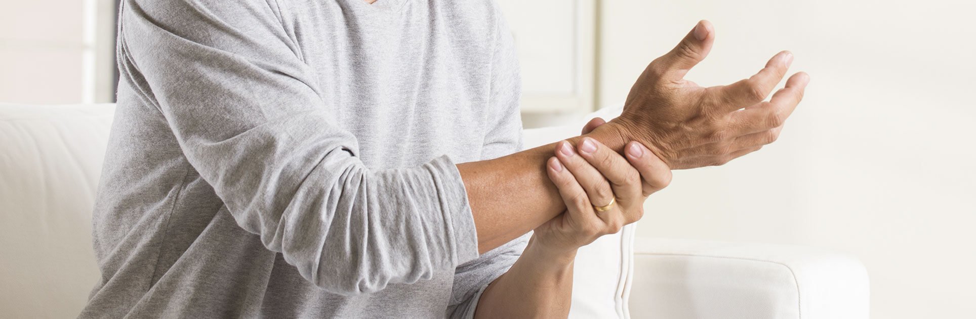 Man holding his wrist Man holding his wrist
