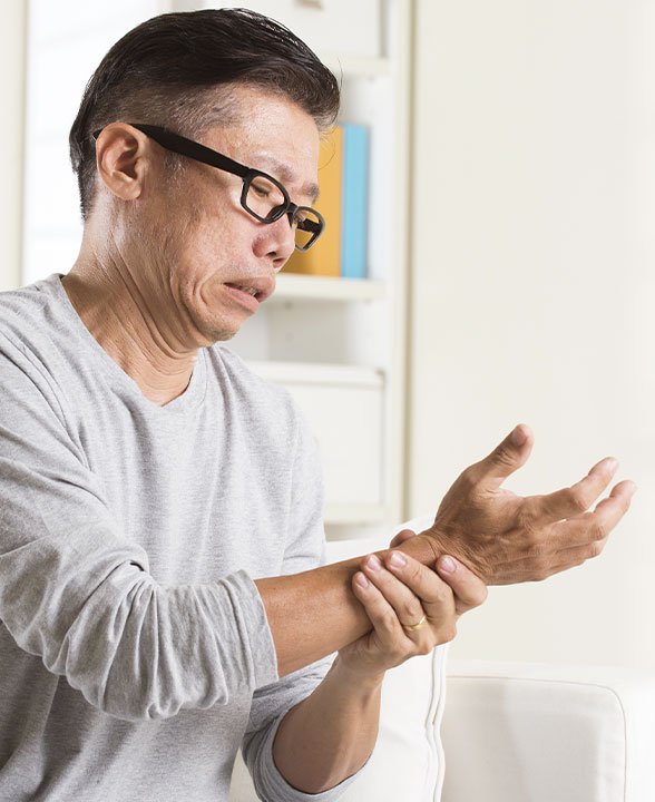 Man holding his wrist Man holding his wrist