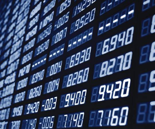 A digital screen showing stock market data