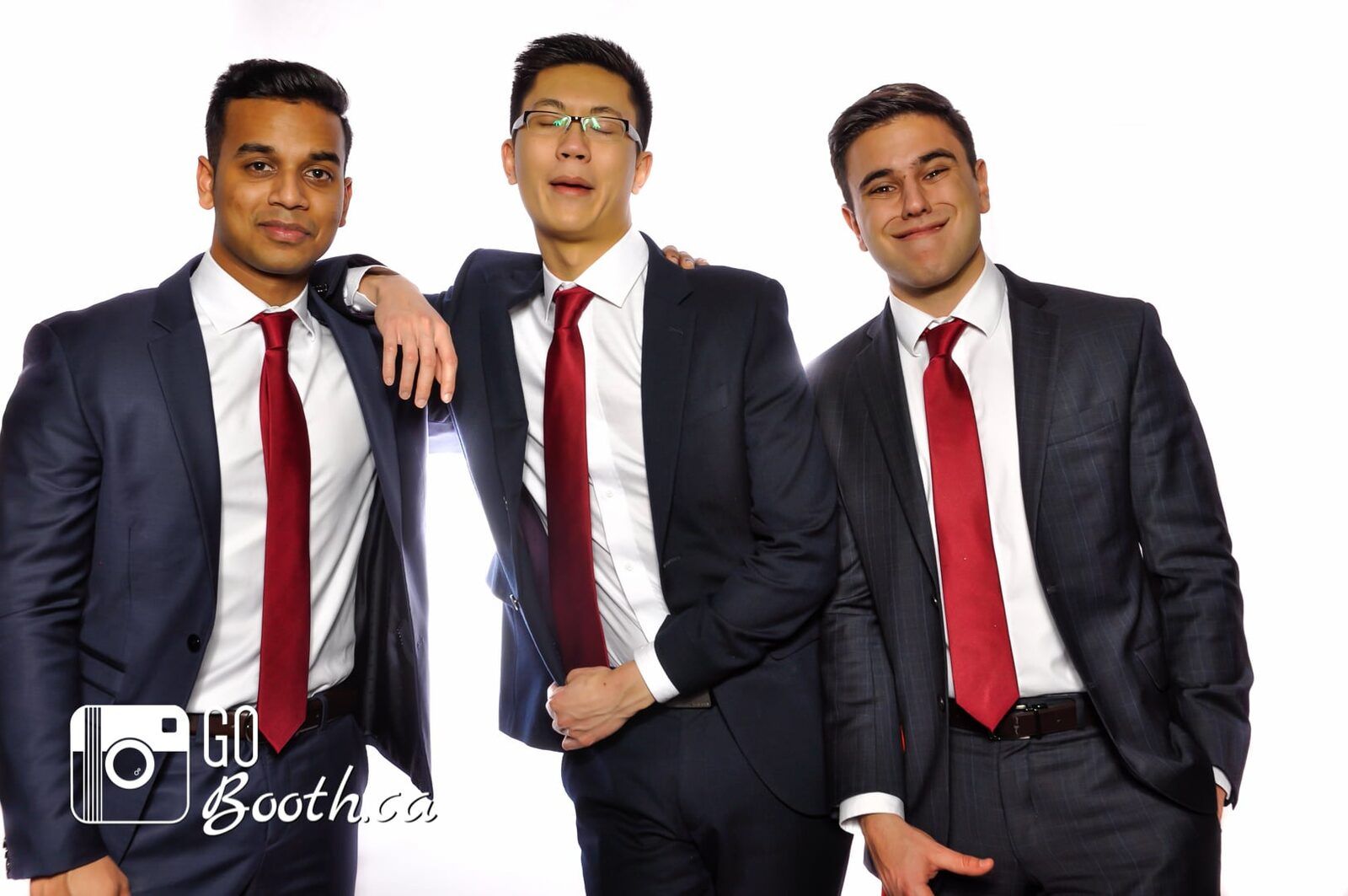 Corporate guests in suits posing at a GoBooth event