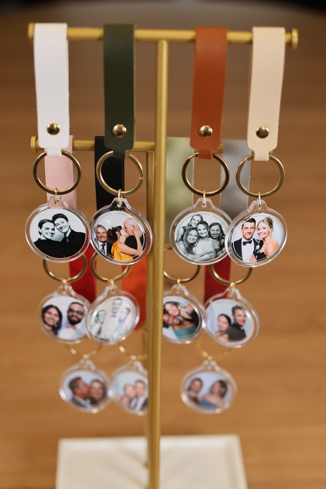 Display stand of finished leather photo keychains at a GoBooth event