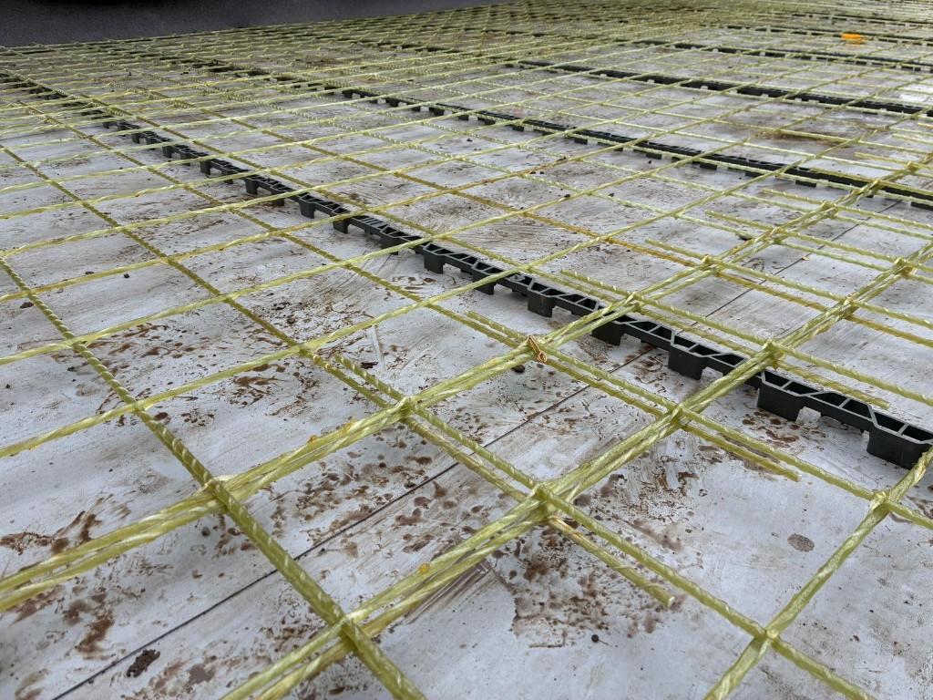 Close-up of twisted glass-fibre mesh on plastic chairs before a terrace pour