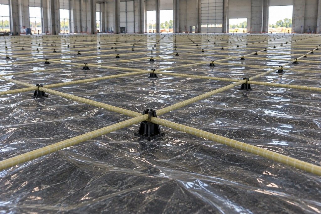 Glass-fibre reinforcement mesh installed for an industrial concrete floor