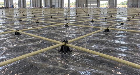 Glass-fibre reinforcement mesh installed for an industrial concrete floor