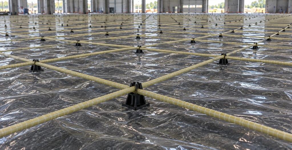 Glass-fibre reinforcement mesh installed for an industrial concrete floor