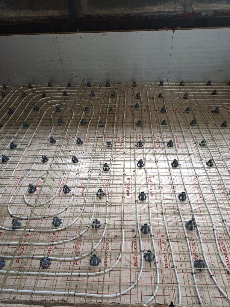 GFRP mesh and underfloor heating pipes before the screed is poured