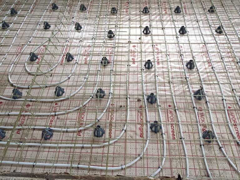 GFRP mesh and underfloor heating pipes before the screed is poured